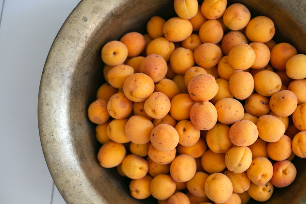 Large bowl of fresh apricots
