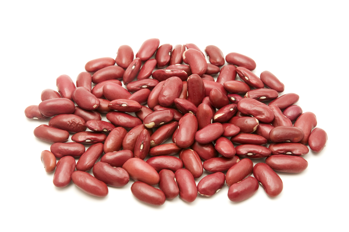 Pile of raw kidney beans on a white background