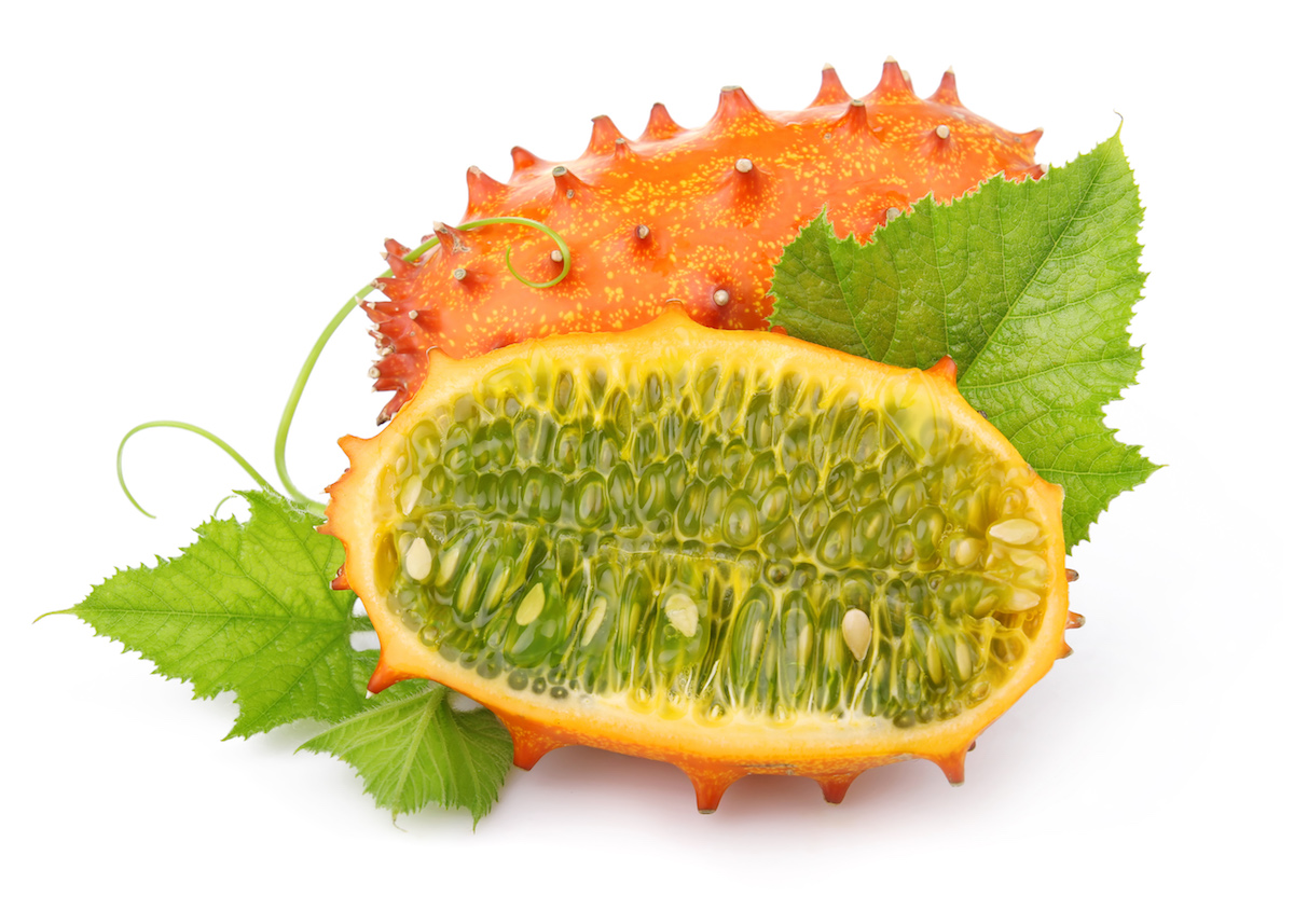 Kiwano fruit cut in half lengthwise to show the green inner flesh.