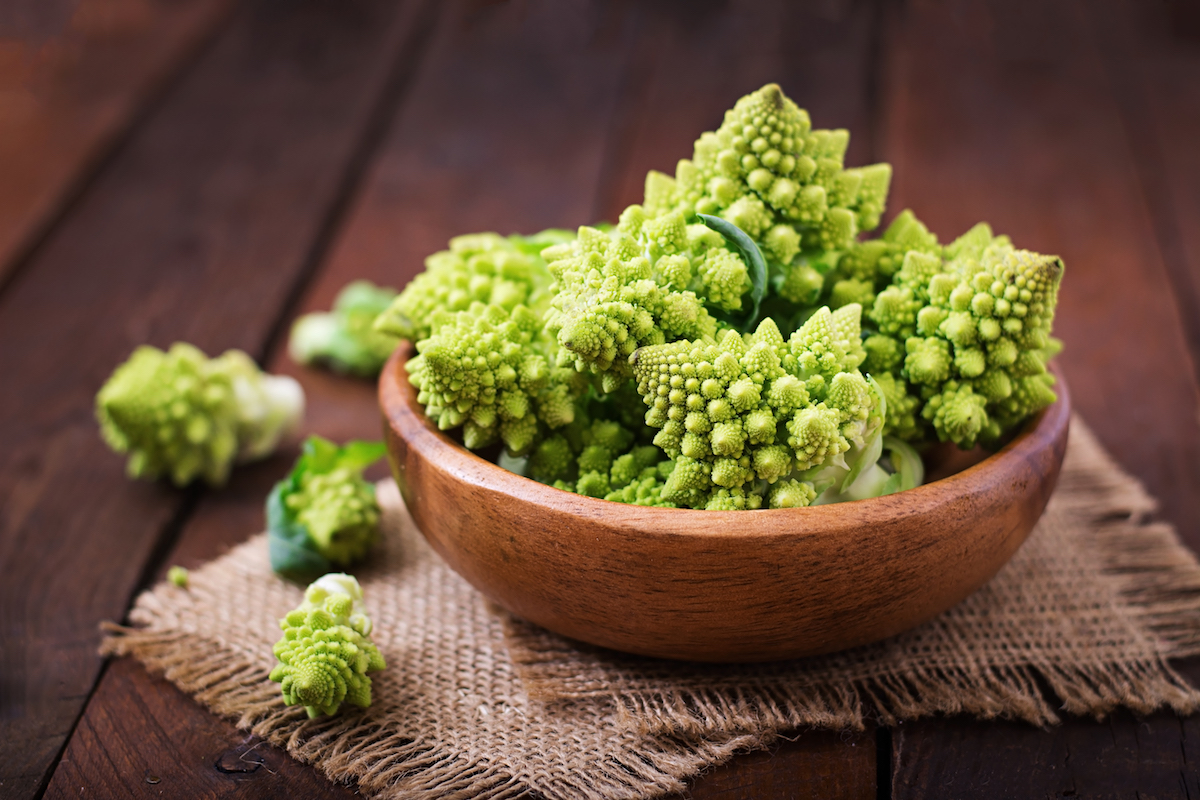 Pile of romanesco florets in a brown wooden bowl