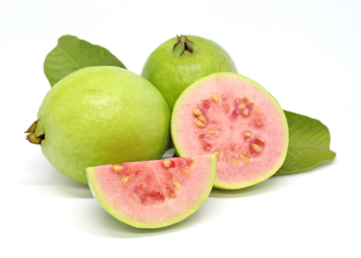 Whole guava fruit, guava cross-section, and guava segment on a white background.