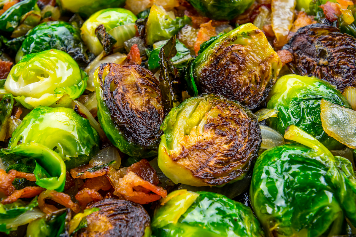 Close up shot of roasted brussels sprouts with bacon